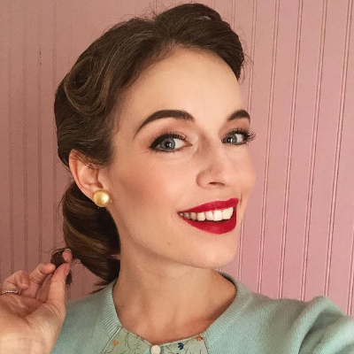 Anni Krueger poasing for a photo shoot for her Instagram feed. 